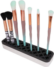 Organizzatore multifunzionale per pennelli e matite per makeup con contenitore in silicone.
