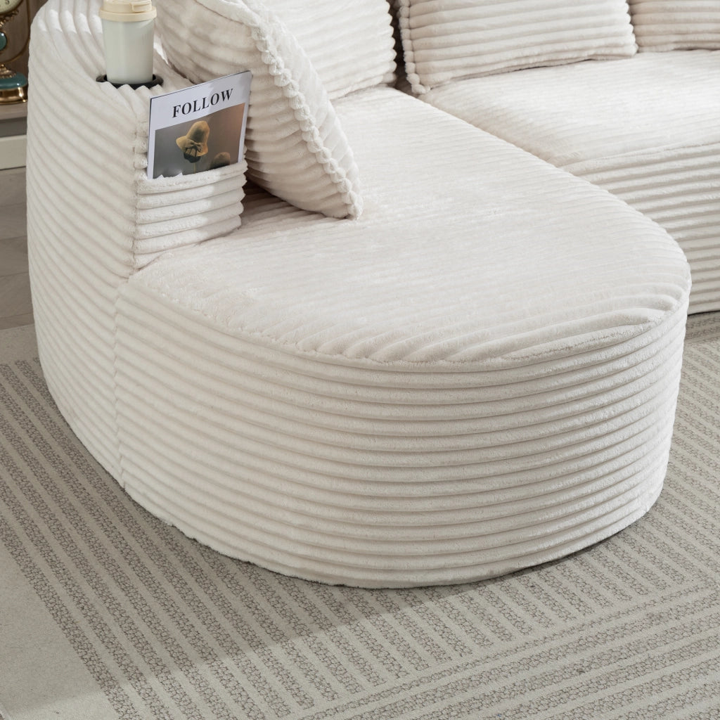 Divano ad arco 250x152x82 cm in tessuto corduroy beige con portabicchieri e tasche laterali