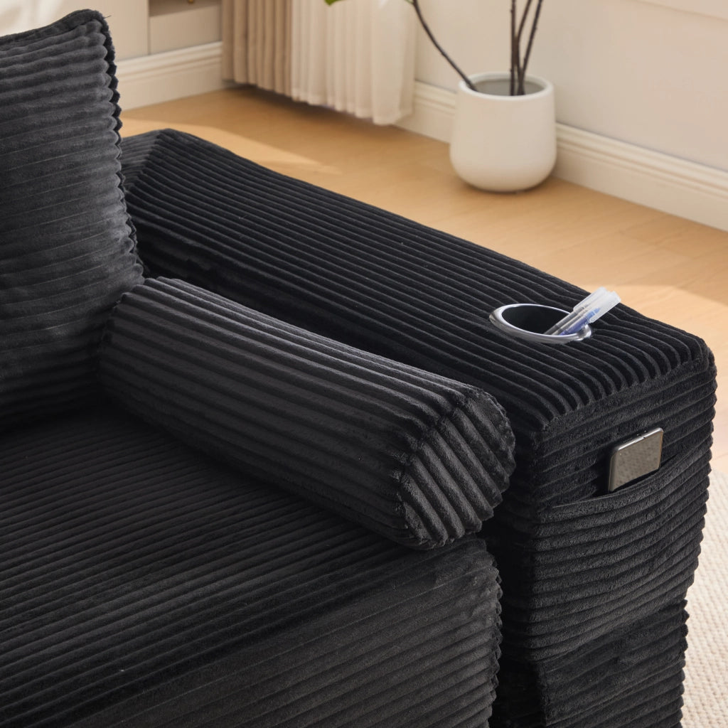 Divano convertibile 2 posti in corduroy con cuscini memory, tasche laterali e portabicchieri nero