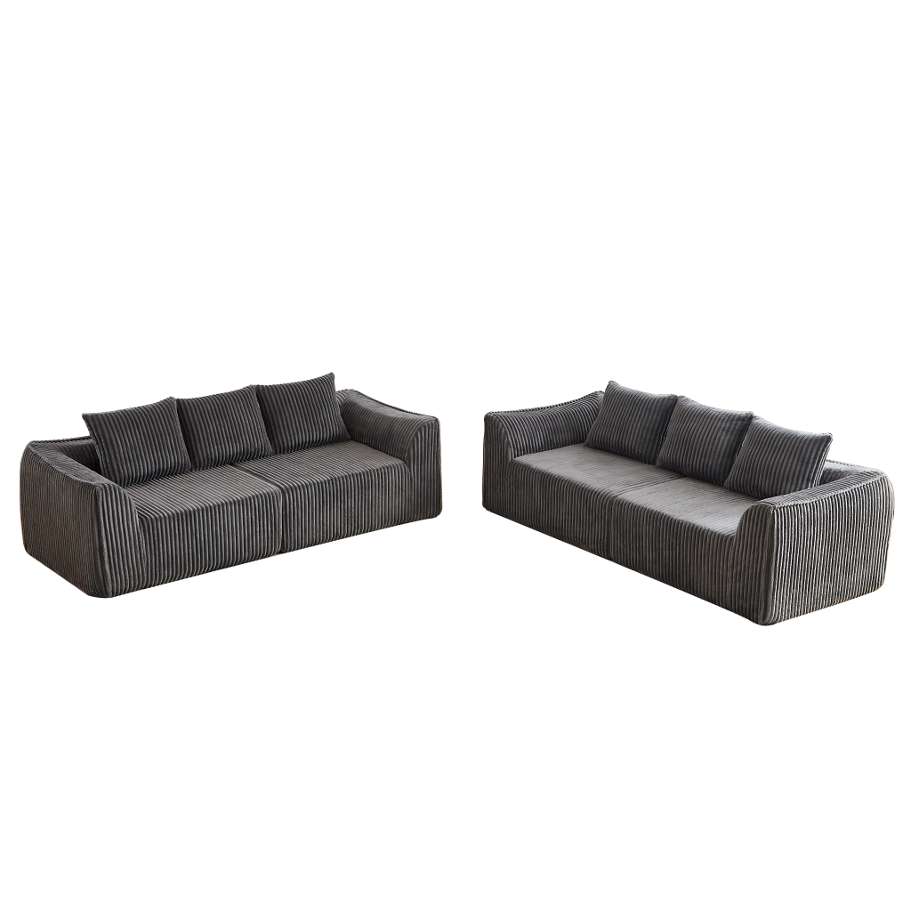 Divano modulare in velluto a coste con linee curve e cuscini in tessuto grigio