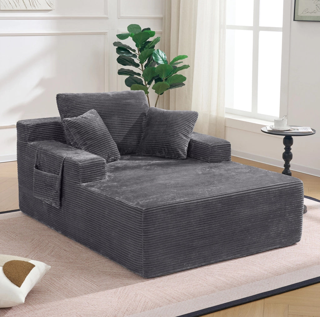 Divano compatto in corduroy con tasche laterali e cuscini; grigio scuro