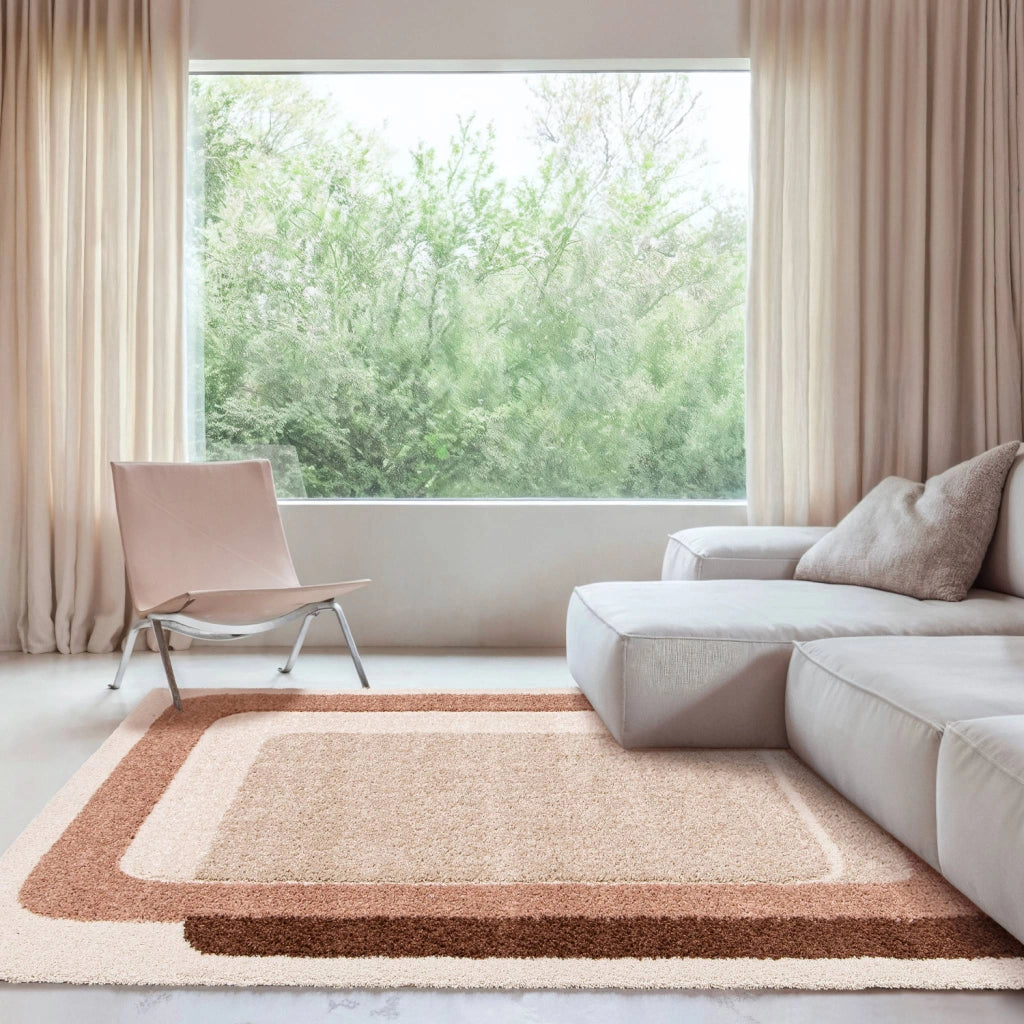 Tappeto da interno con motivo grafico marrone, rosa e beige